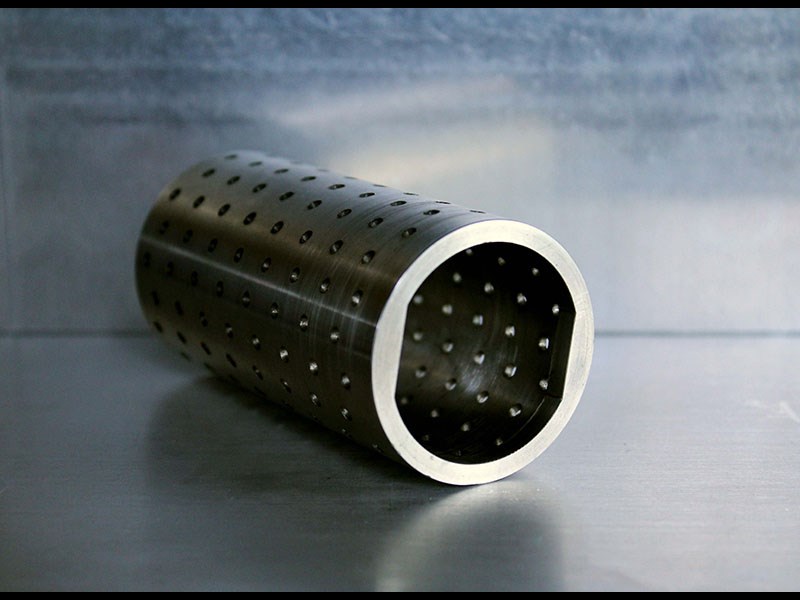 Cylindrical part with holes